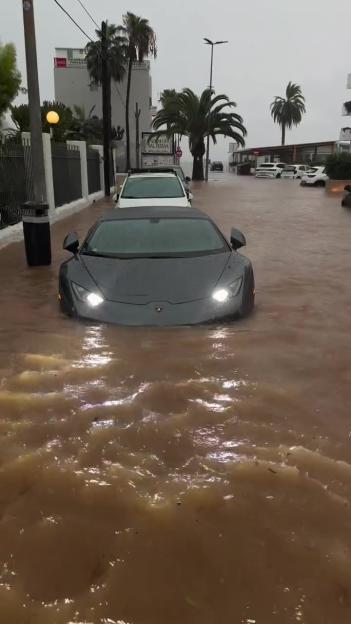Luxury supercar submerged in floodwaters in Ibiza.