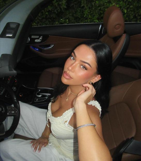 Woman in a car.