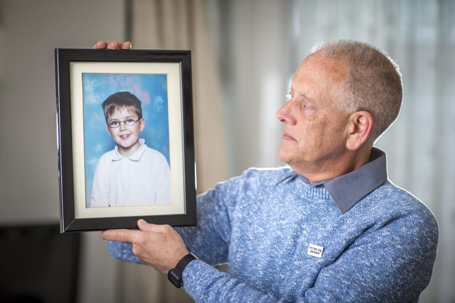 Kevin Gosden, father of missing Andrew Gosden, holds a framed photograph of his son.