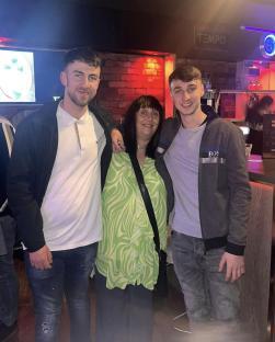Photo of Jay Slater with his mother and brother.