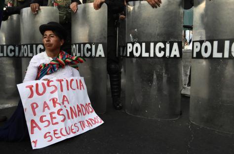 Protestor holding a sign that reads
