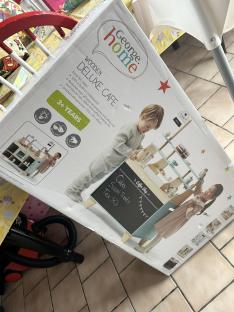 Box showing a children's wooden deluxe cafe playset.