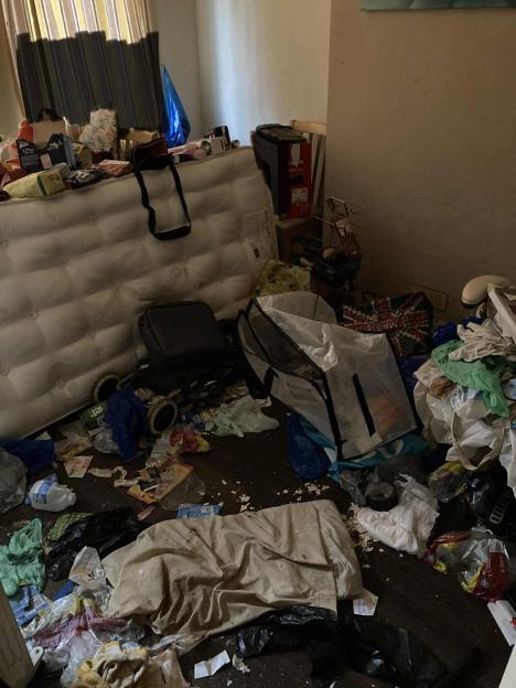 A bedroom left with rubbish and mattress left, found by landlord.