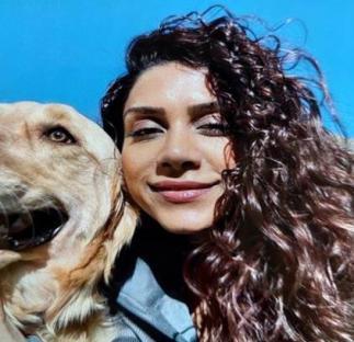 Photo of Paria Veisi with a dog.