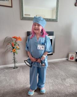Girl dressed as a doctor.