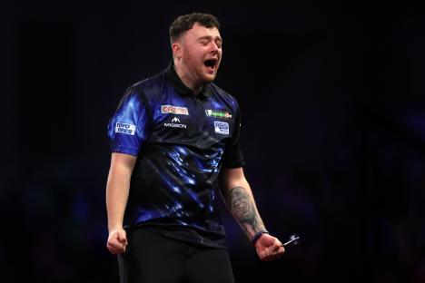 Josh Rock of Northern Ireland celebrates a darts win.