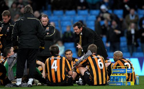 Hull City manager Phil Brown addressing his team during halftime.
