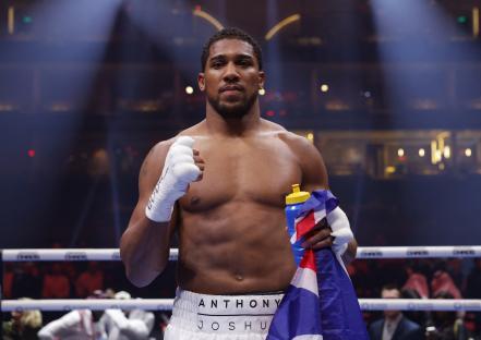Anthony Joshua victorious in boxing match.