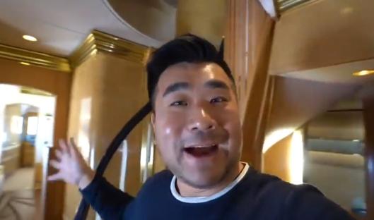 Man giving a tour of a luxurious interior.