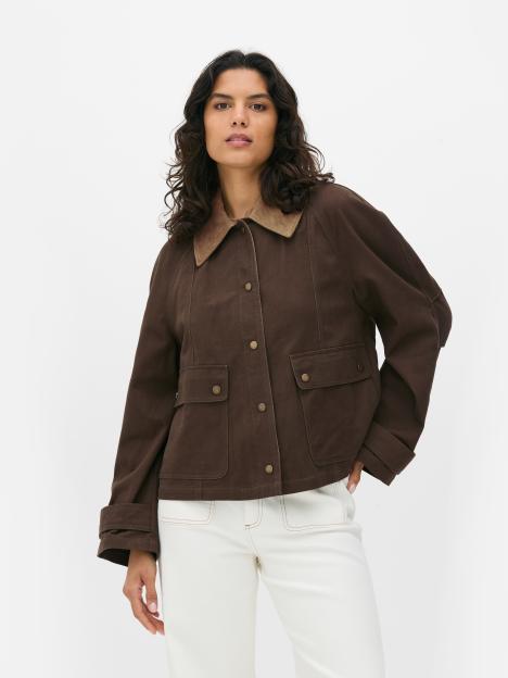 Model wearing a brown jacket with a corduroy collar.
