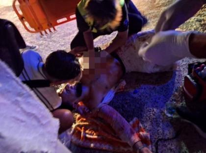 A man receiving first aid after a stabbing.