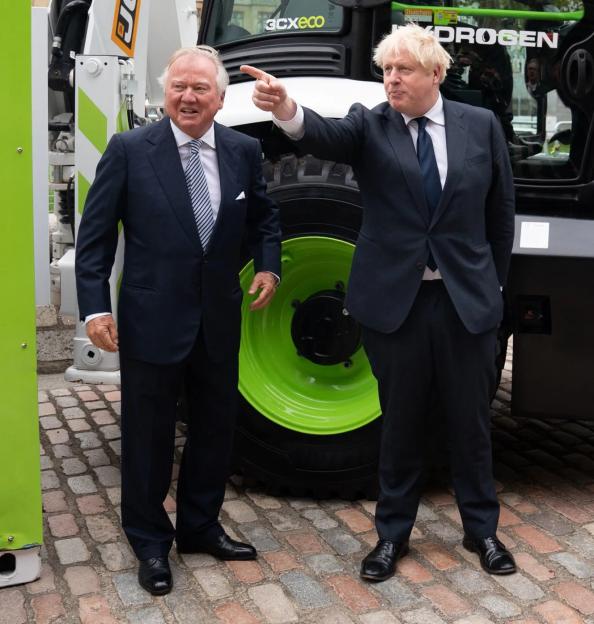 Boris Johnson and JCB chairman Lord Bamford at the unveiling of a hydrogen-powered JCB Loadall.