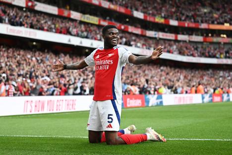 Thomas Partey of Arsenal celebrating a goal.