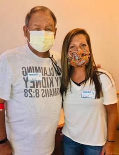 Jocelynn and Terrell wearing masks and event name tags.