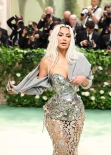 Kim Kardashian at the Met Gala in a silver sequined gown.