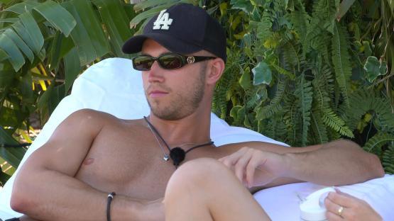 Ron Hall from Love Island: All Stars relaxing on a lounger.