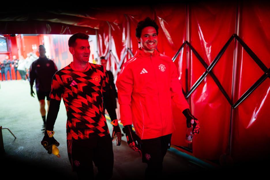 Tom Heaton and Senne Lammens of Manchester United walking out of the tunnel.