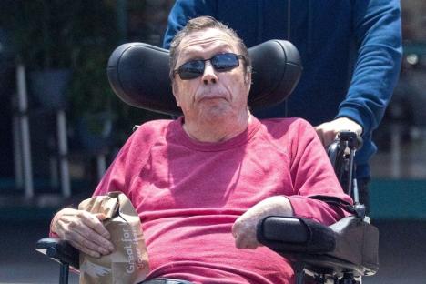 Legendary Brit actor Tim Curry seen on rare outing with his carer 13 years after Rocky Horror star suffered a stroke
