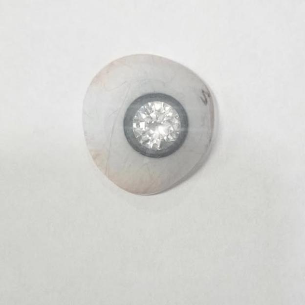 An artificial eye with a diamond in the center.