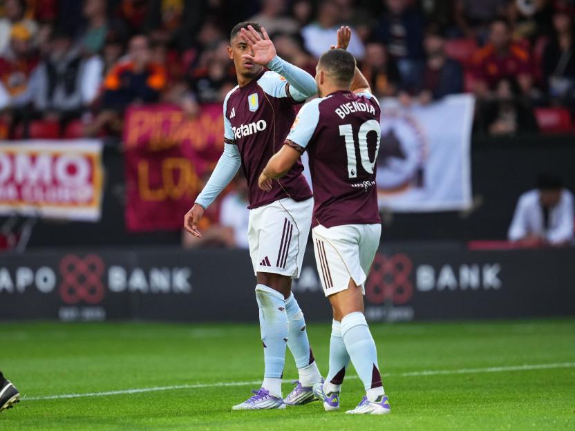 Aston Villa players celebrating a goal.