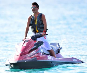 Simon Cowell jetskiing.