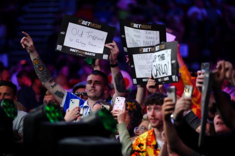 Leeds United fans in the crowd taunt Luke Littler before the semi-final match against Gerwyn Price on night fourteen of the BetMGM Premier League at First Direct Arena, Leeds. Picture date: Thursday May 8, 2025. PA Photo. See PA story DARTS Leeds. Photo credit should read: Mike Egerton/PA Wire. RESTRICTIONS: Use subject to restrictions. Editorial use only, no commercial use without prior consent from rights holder.