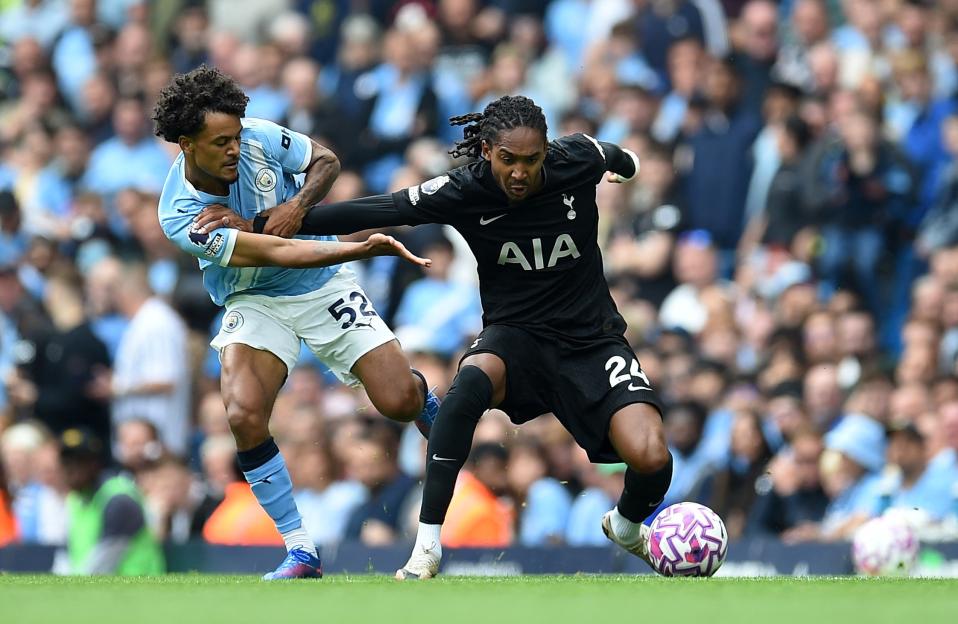 Manchester City's Oscar Bobb vying for the ball.