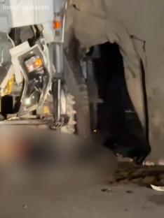 Footage of an elephant trying to rescue its calf trapped under a lorry.