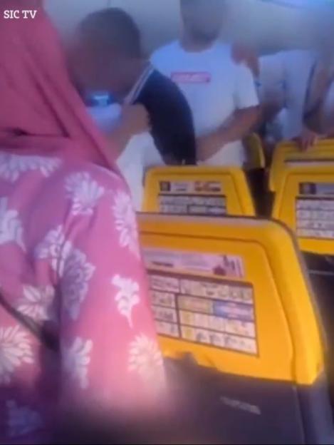 Screenshot of a crowded bus.