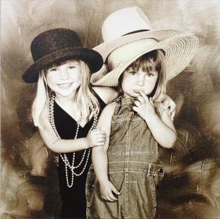 Sepia-toned photo of Sam and Billie Faiers as children.