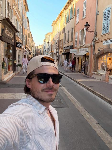 Selfie of Brooklyn Beckham on a street in a European city.