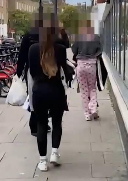 Moment pyjama-clad ‘shoplifter’ and her brazen pals make off with £400 of H&M clothes in daylight high street raid