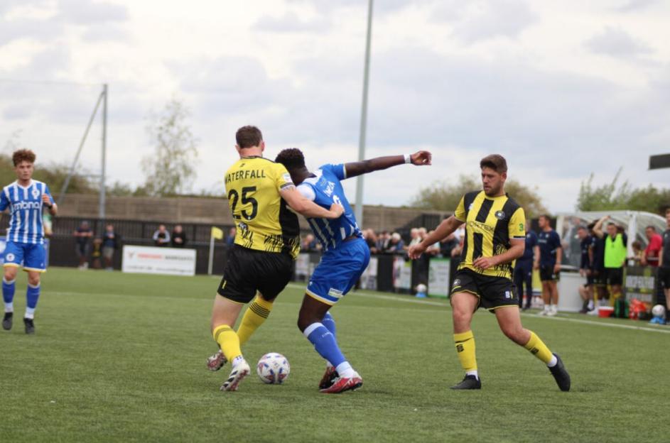 Soccer players vying for the ball during a match.