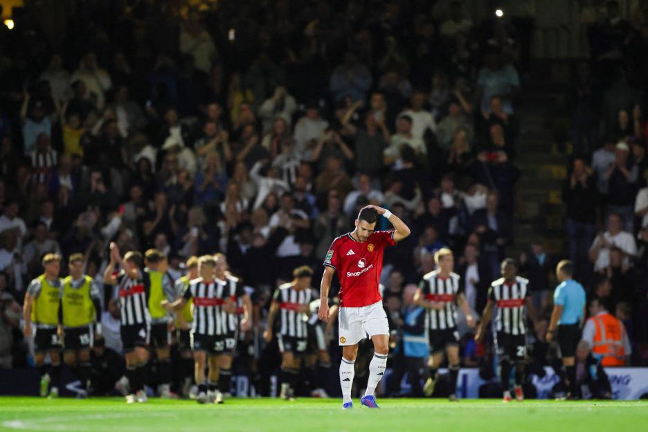Diogo Dalot of Manchester United looking dejected on the field.