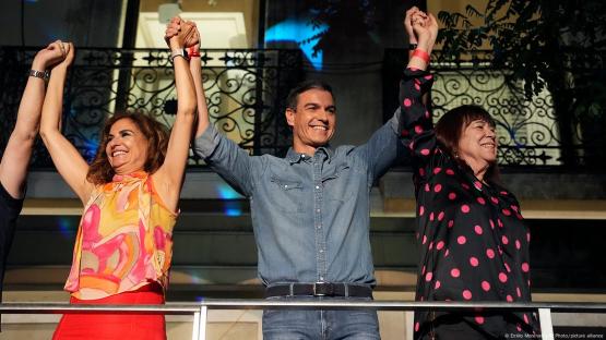Socialist Workers' Party leader and current Prime Minister Pedro Sanchez greets supporters outside the party's headquarters in Madrid