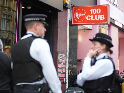 Police officers outside the 100 Club in Oxford Street, London.