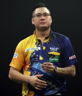 Rowby-John Rodriguez at a darts tournament.