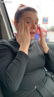 Roxanne Hoyle crying in a car.