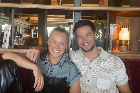 JoJo Siwa is returning to UK to be reunited with Chris Hughes after they’re pictured kissing