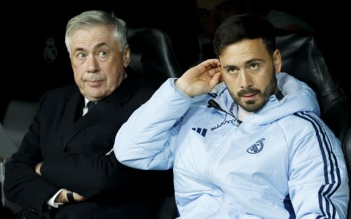 Carlo Ancelotti and Davide Ancelotti at a Real Madrid soccer match.