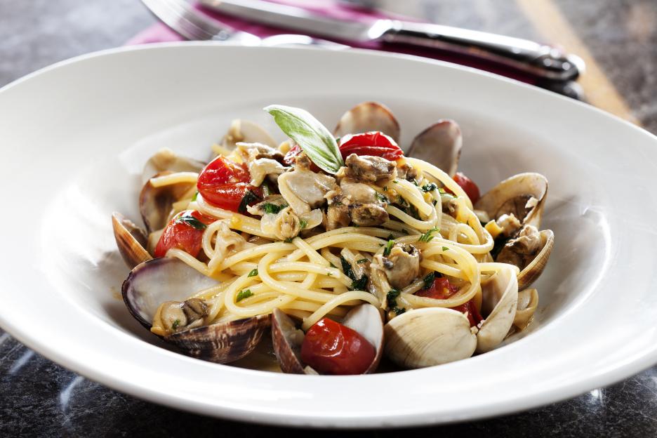 Spaghetti with clams and cherry tomatoes.