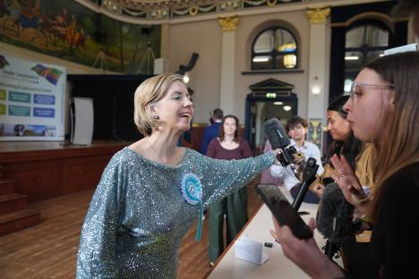 Dame Andrea Jenkyns pushes away a journalist's microphone after winning an election.