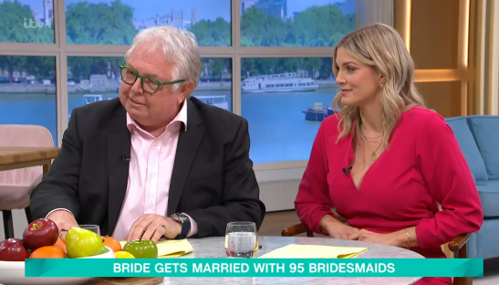 Two people sitting at a table discussing a bride with 95 bridesmaids.