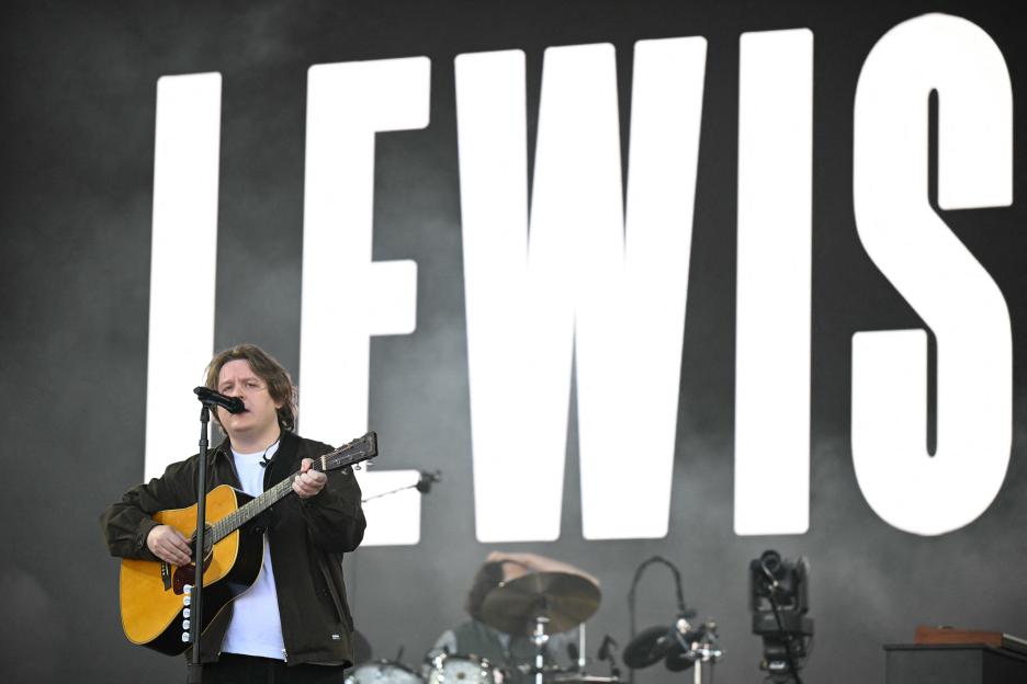 Lewis Capaldi performing at a music festival.