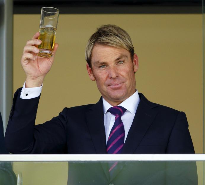 Shane Warne toasting at the races.