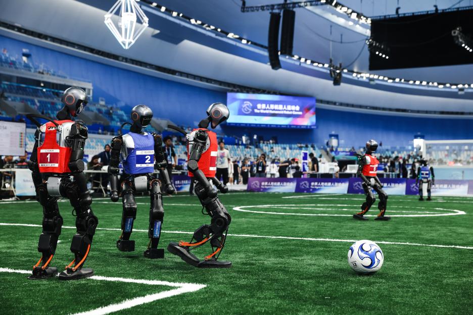 Humanoid robots playing soccer at the World Humanoid Robot Games.
