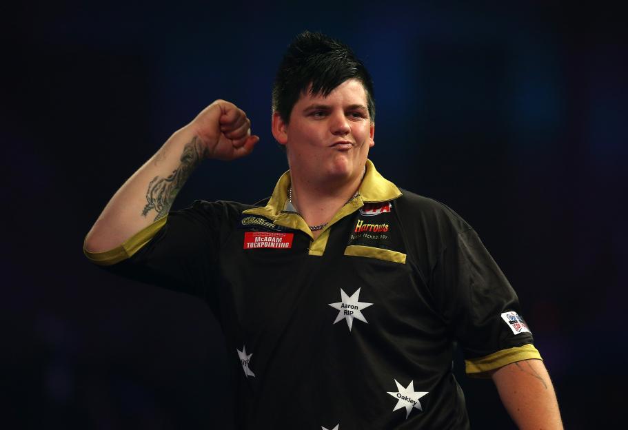 Corey Cadby of Australia celebrates a darts victory.