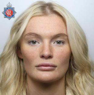 Mugshot of a blonde woman.