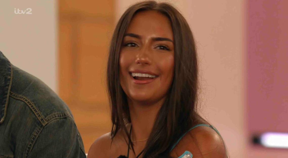 Meg from Love Island smiling.