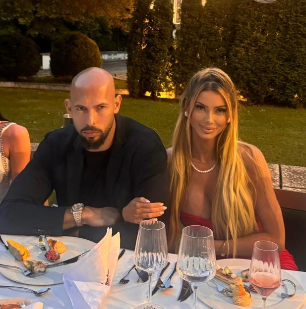 Bri Stern and Andrew Tate at an outdoor dinner.